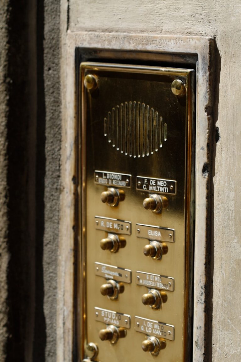 A close up of a phone on the side of a building
